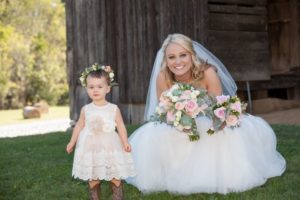 bride bouquet and flower girl photo