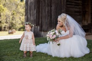 Bride flower girl 300x200 - Bride & flower girl at Nashville barn wedding venye