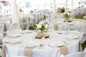 outdoor wedding tables under tent tree slice centerpiece