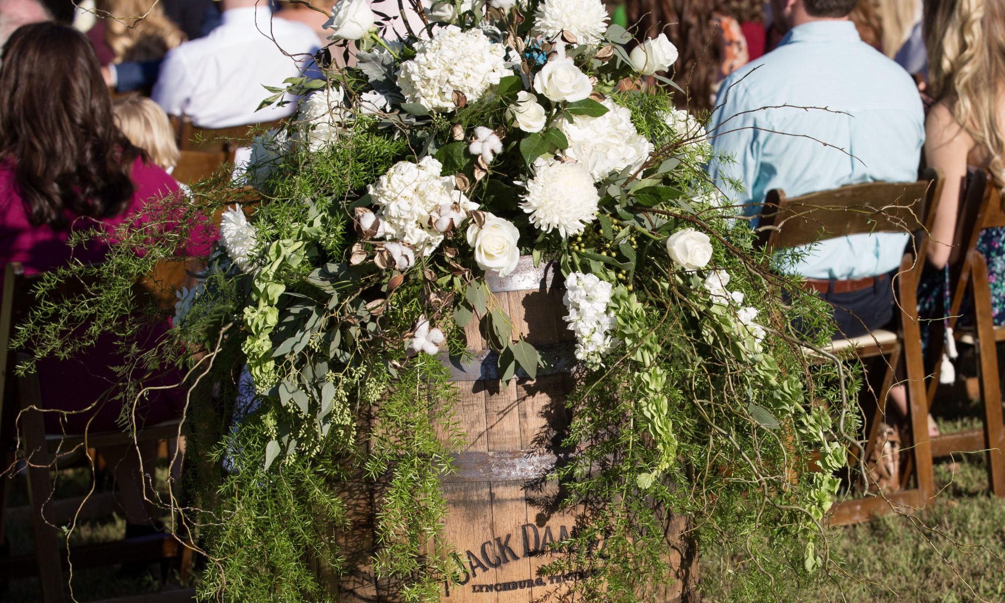 wedding flowers centerpiece on whiskey barrel